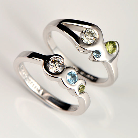 Two engagement rings made with special meaning.