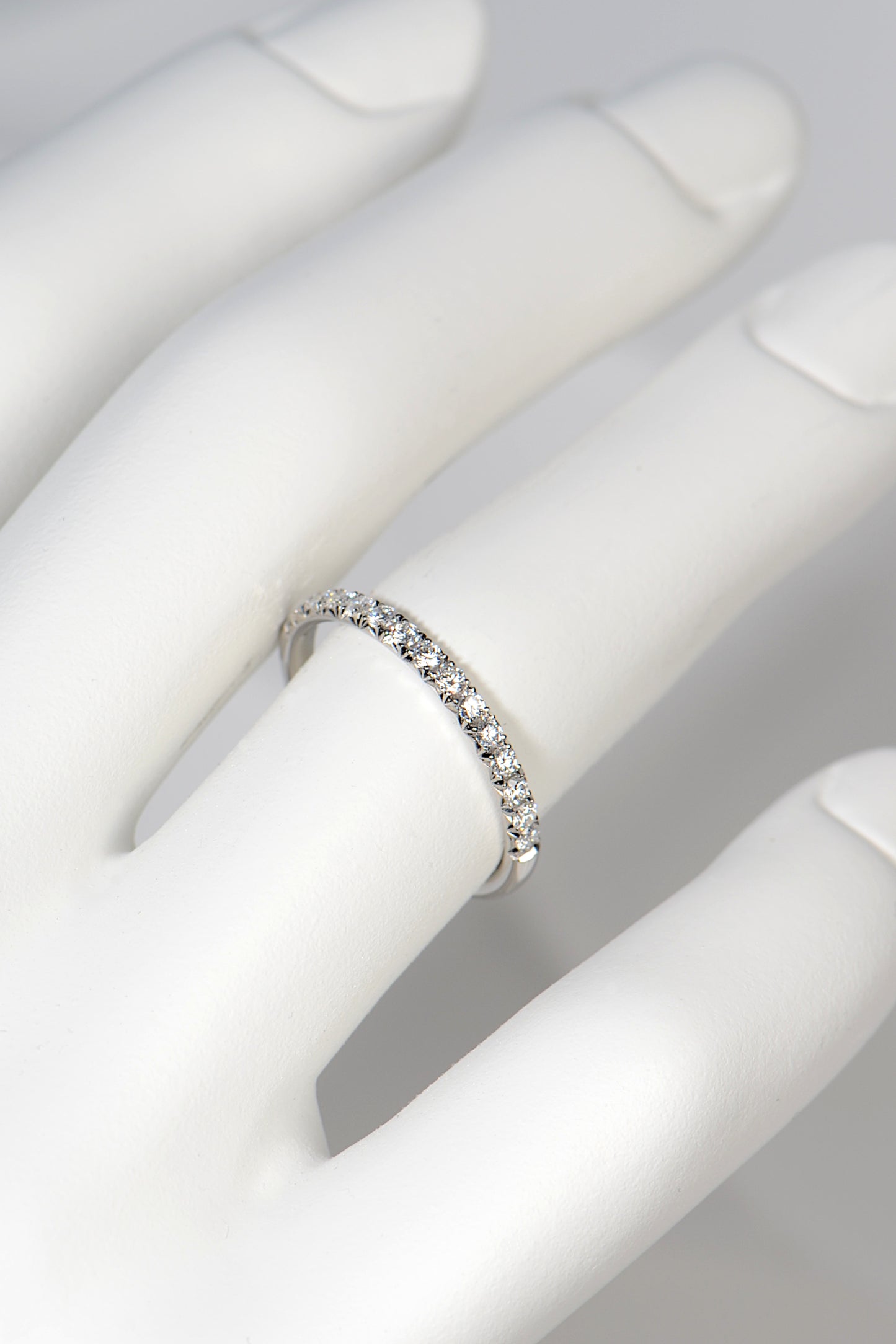 Diamond set eternity or wedding ring with fishtail setting