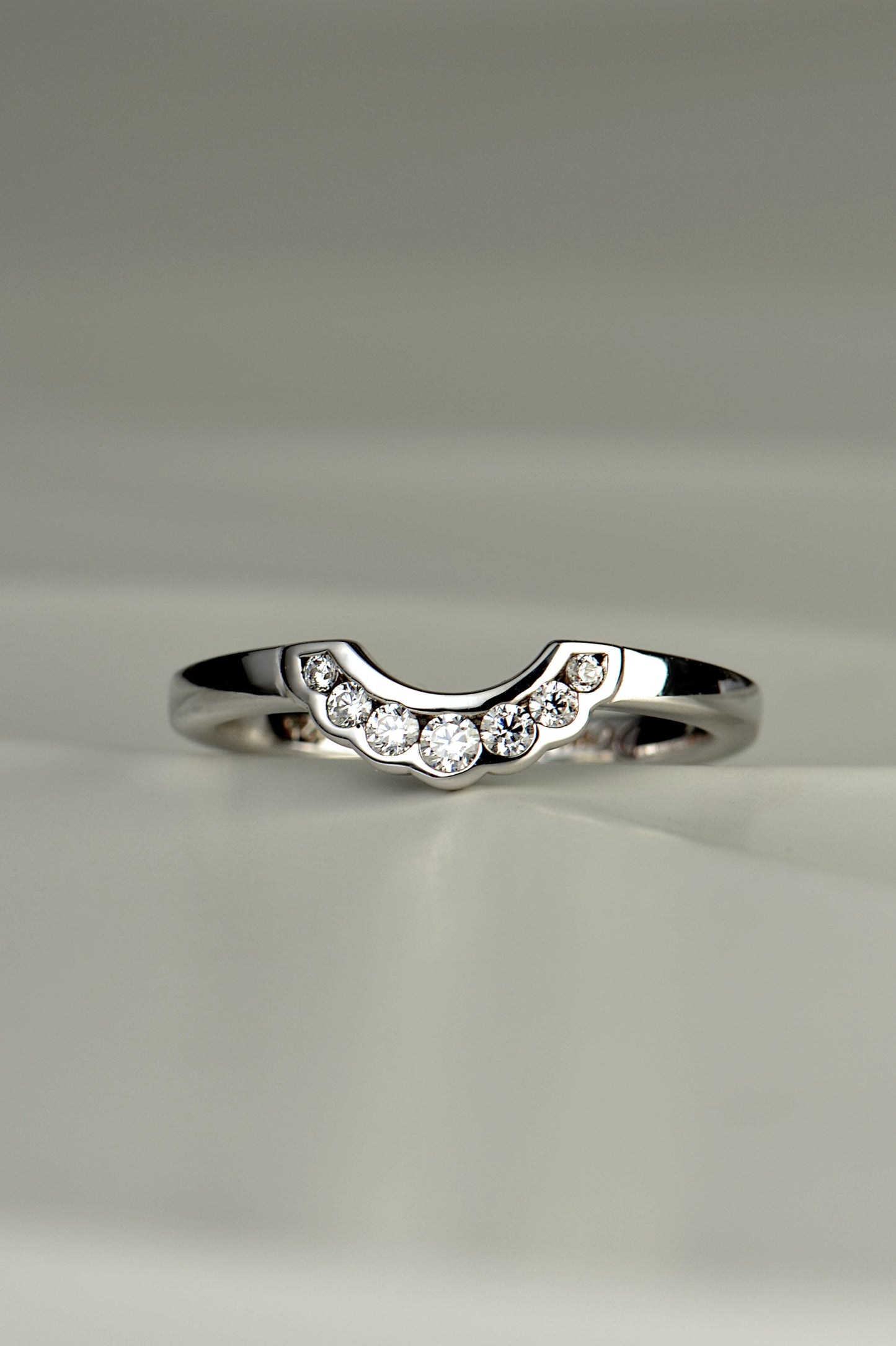 diamond set U shaped wedding ring with modern scalloped edge detail