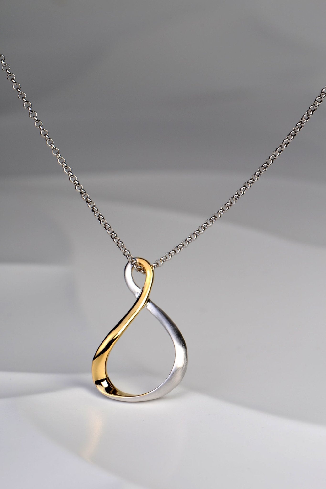 Modern two tone loop necklace from Jorge Revilla's Venice collection