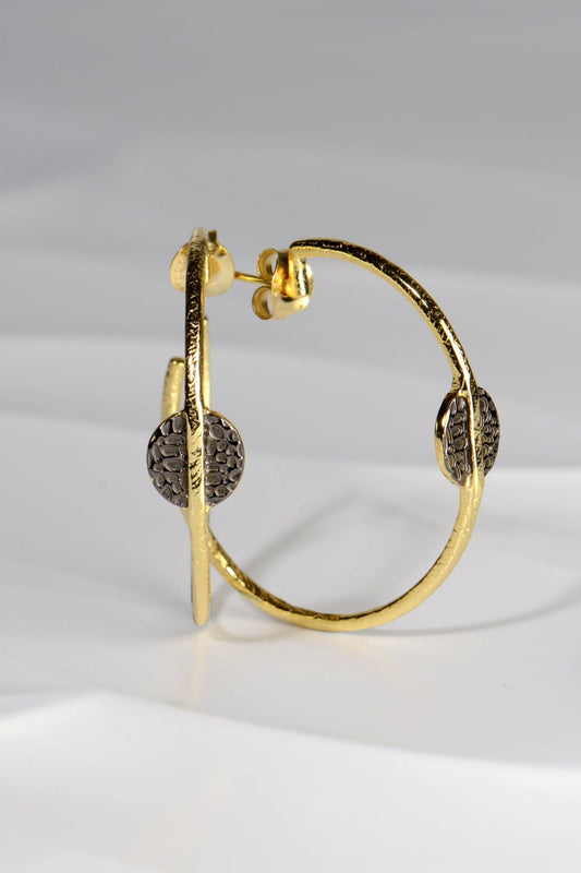 large gold vermeil hoop earrings with black ruthenium detail by jewellery designer Jorge Revilla