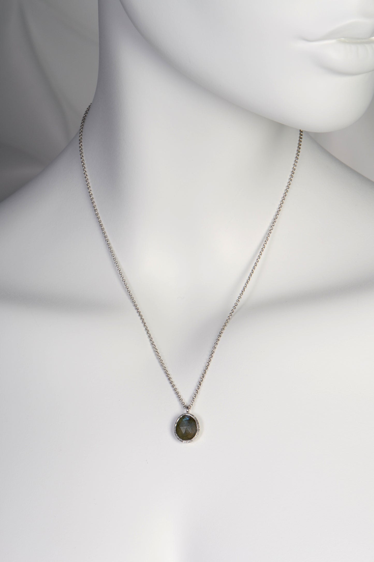 dark grey gemstone labradorite oval pendant on fine silver chain by jewellery designer Jorge Revilla