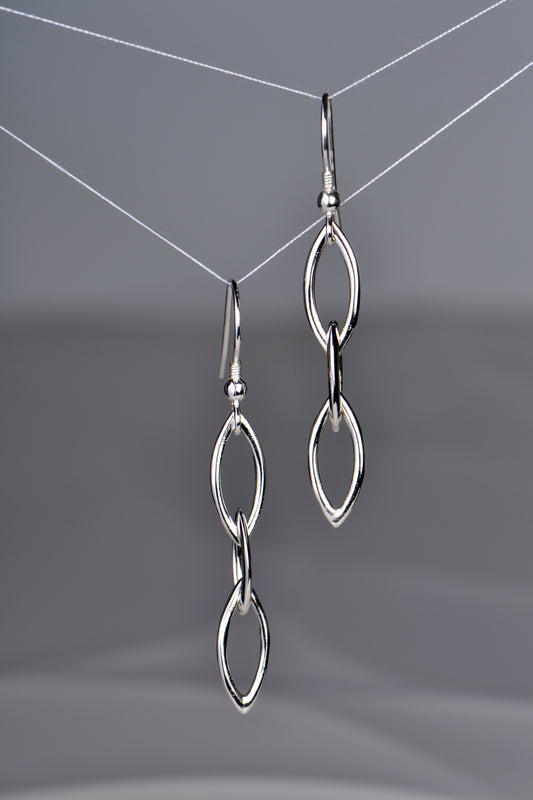 long drop sterling silver earrings. Three almond shape links hang below a silver hook fitting