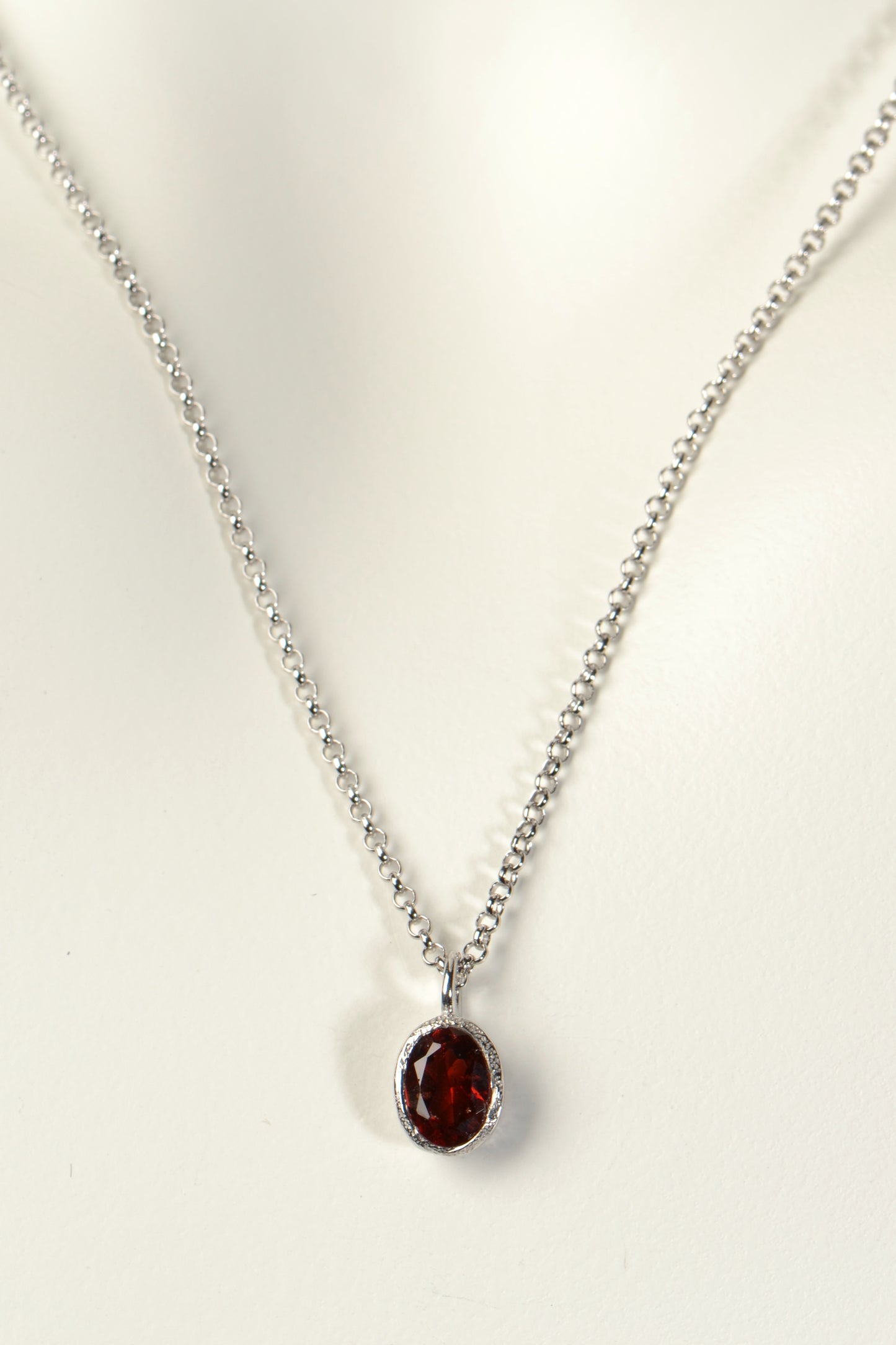 designer silver oval garnet necklace