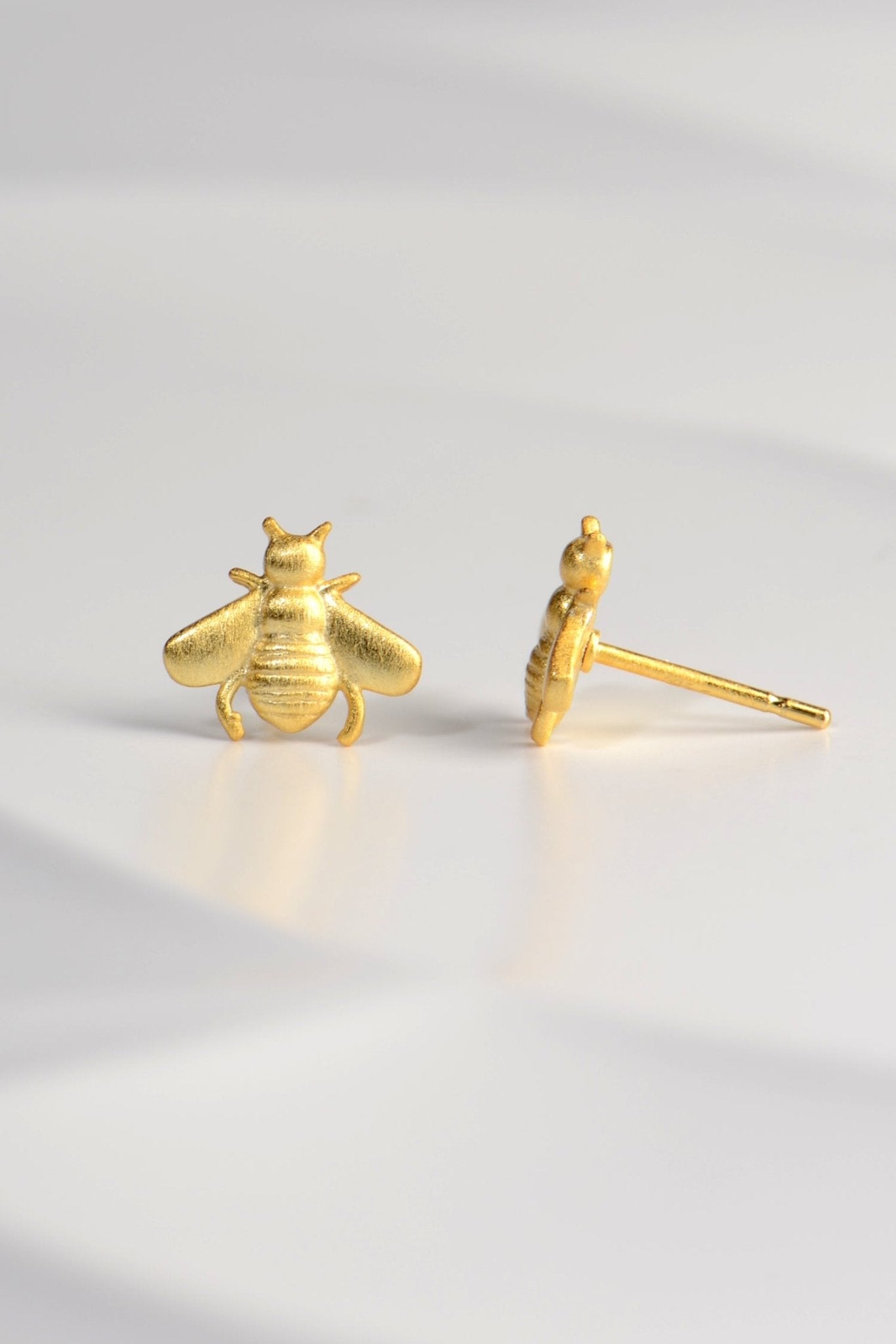designer bee earrings by Jorge Revilla