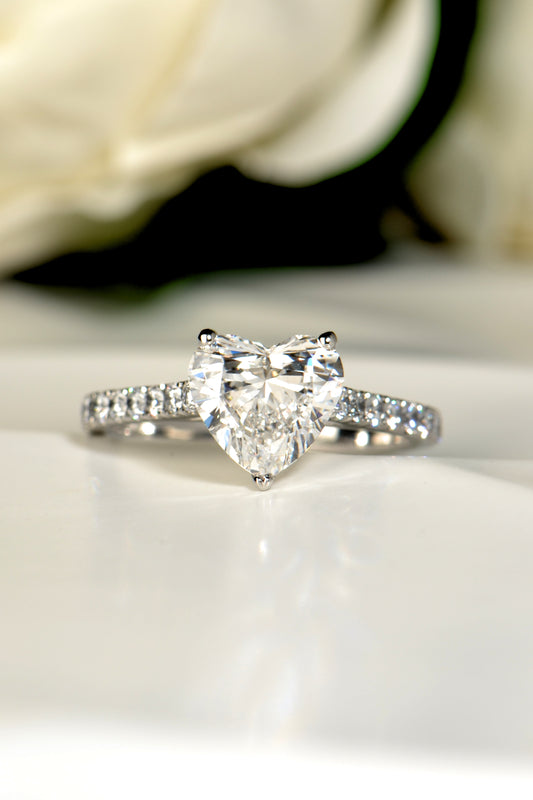 Face-on view of a 2.01 carat heart shaped lab diamond engagement ring in platinum, showing the D colour VVS centre stone and hand-set diamond shoulders.