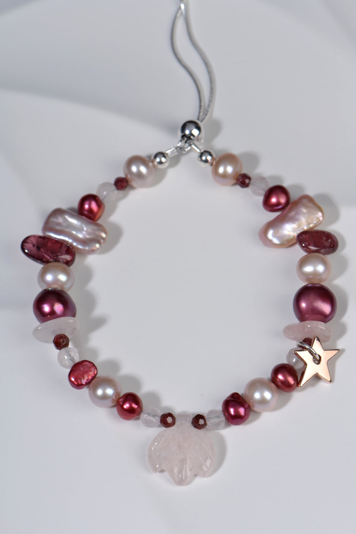 designer bracelet with pink and raspberry pearls and gemstones