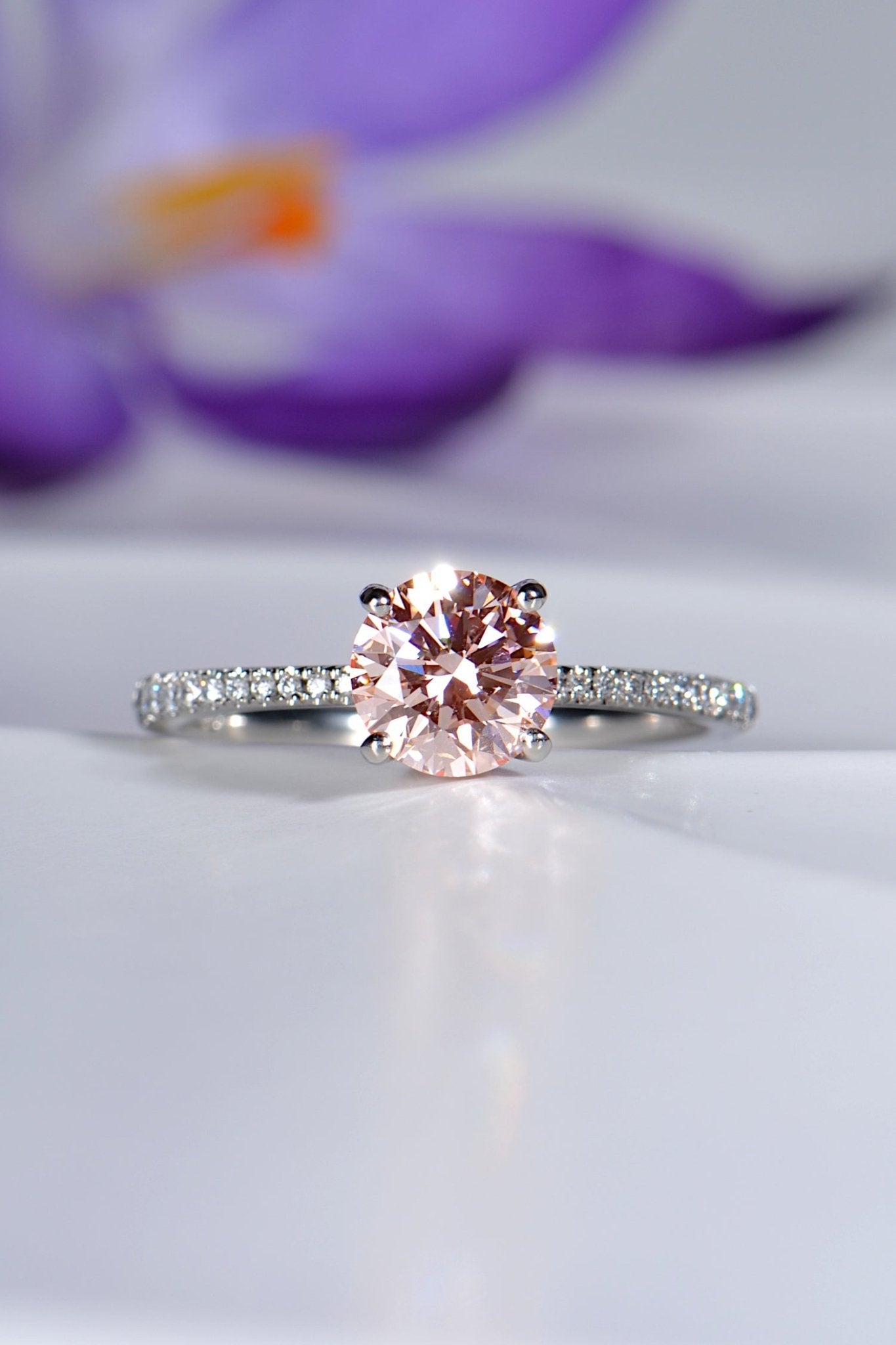 modern engagement ring design set with a one carat pink lab diamond and diamond in the shoulders - Christine Sadler