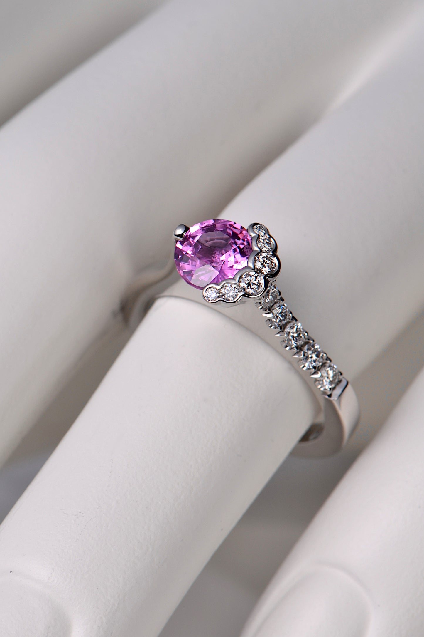 pink sapphire and diamond fairypools designer scottish ring on a model's finger