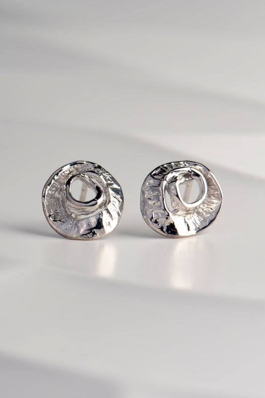small silver earrings inspired by the texture of seaweed