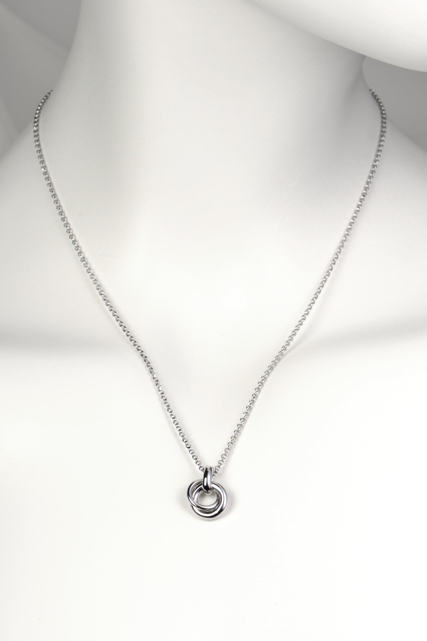 delicate modern silver necklace in the shape of a friendship knot from Christine Sadler