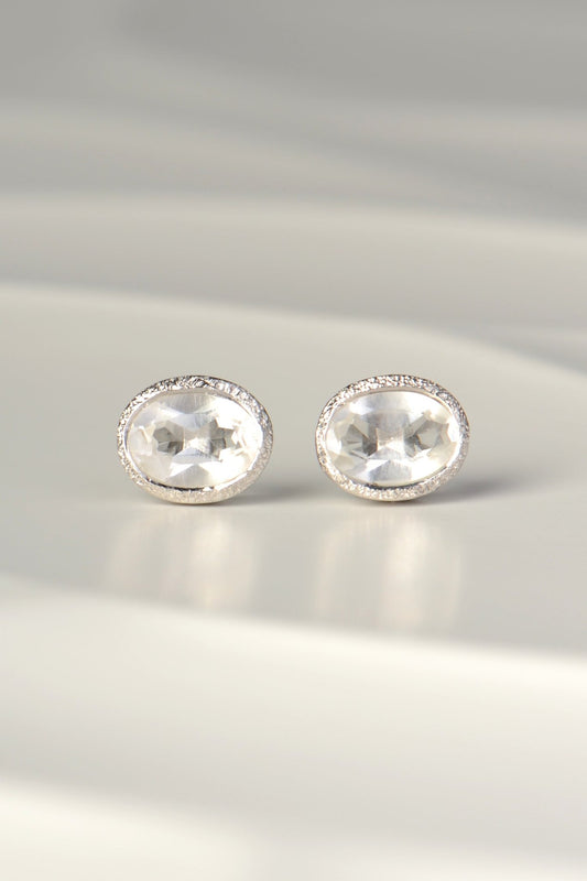 designer silver April birthstone earrings