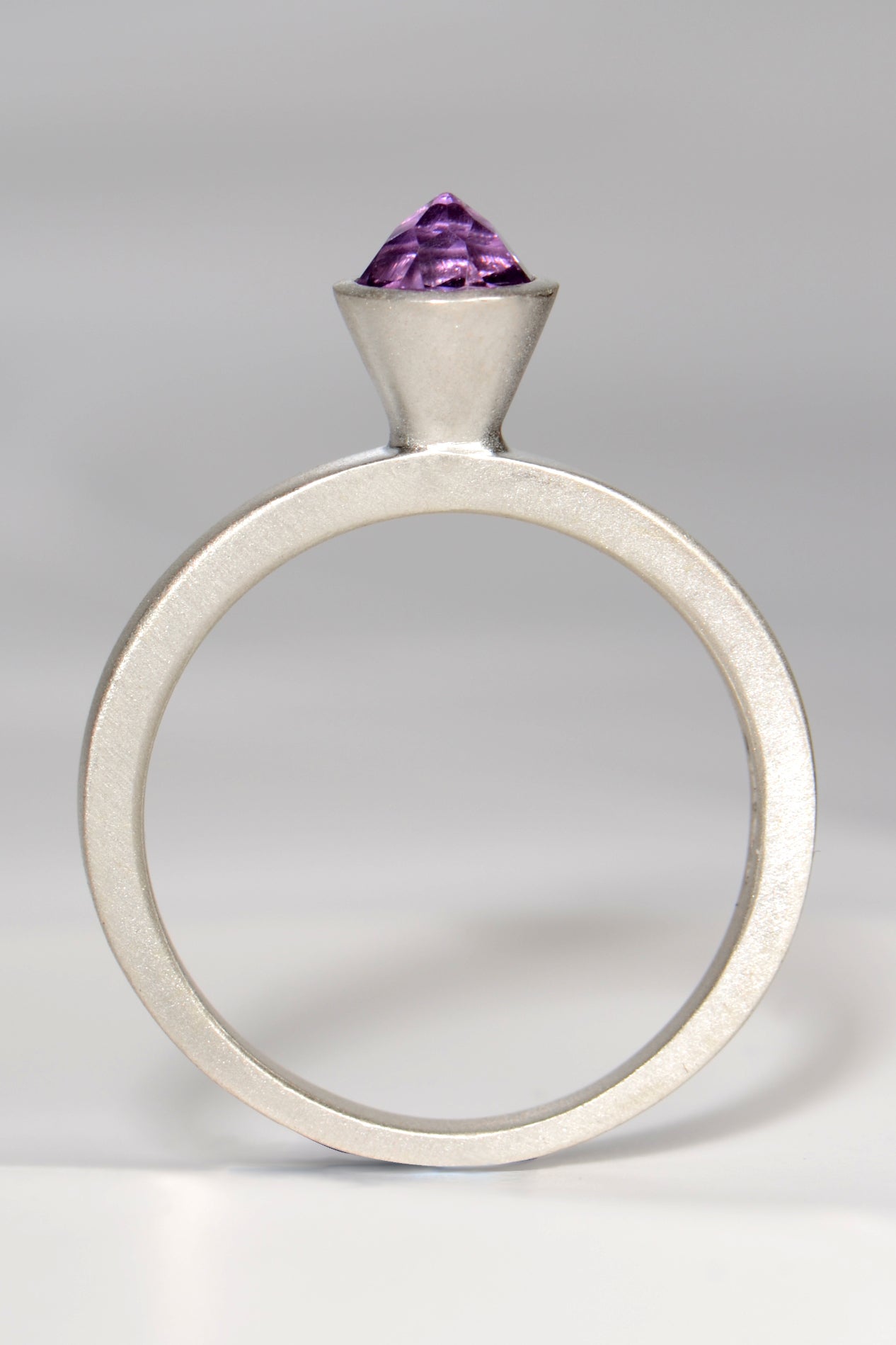 contemporary handmade silver designer ring with an amethyst gemstone. This ring is designed to look like a cupcake.