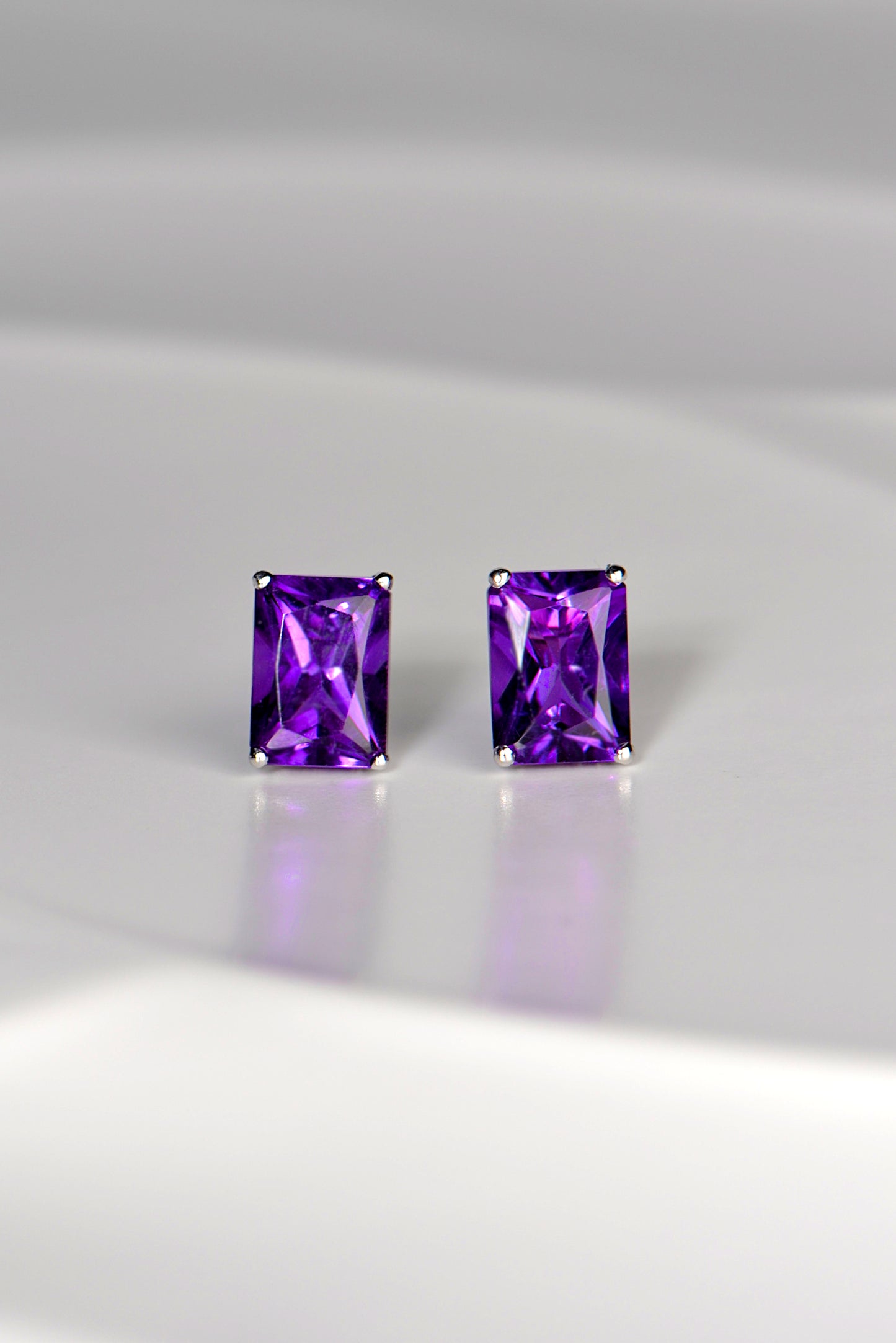 Radiant cut amethyst white gold earrings