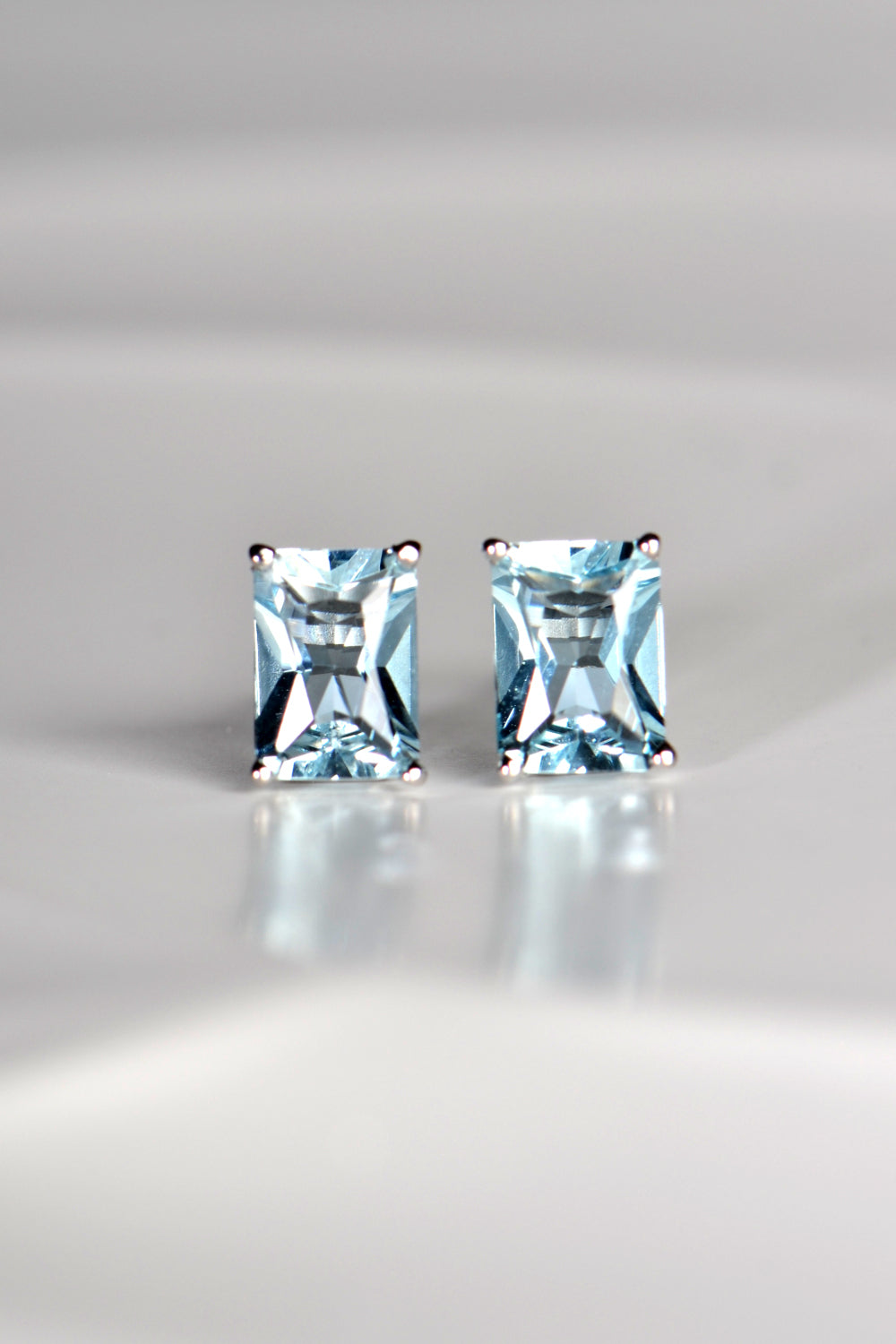 Radiant cut white gold aquamarine earrings