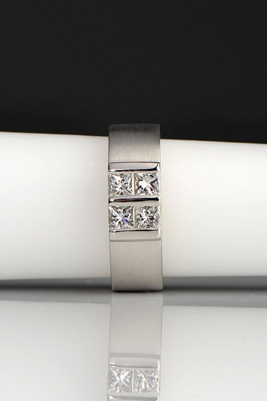 Contemporary platinum and diamond princess cut ring inspired by battenberg cake. Four princess cut diamonds form a square on top of a wide paltinum band