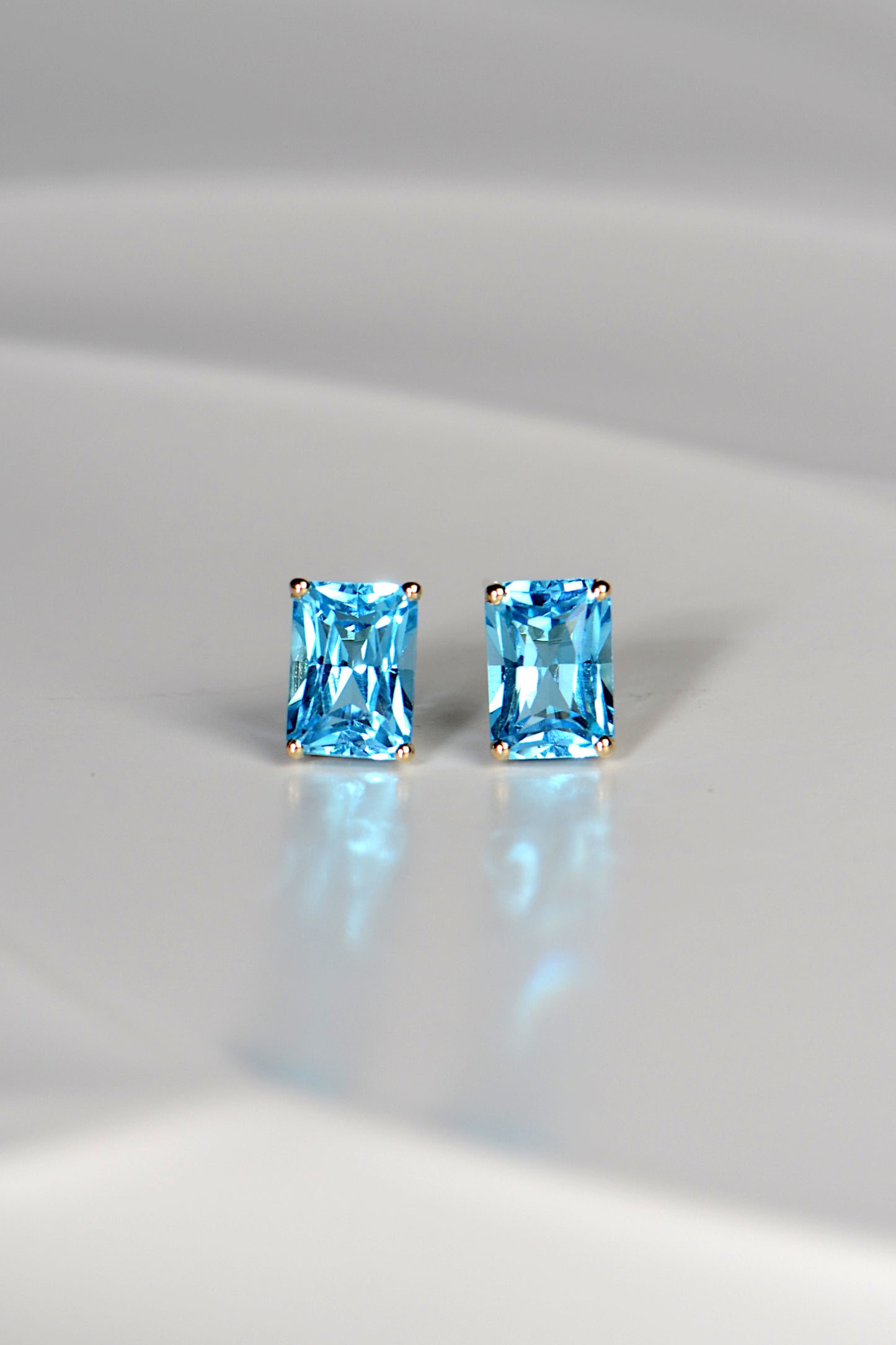 high quality swiss blue topaz stud earrings in yellow gold Christine Sadler jewellery Ayr