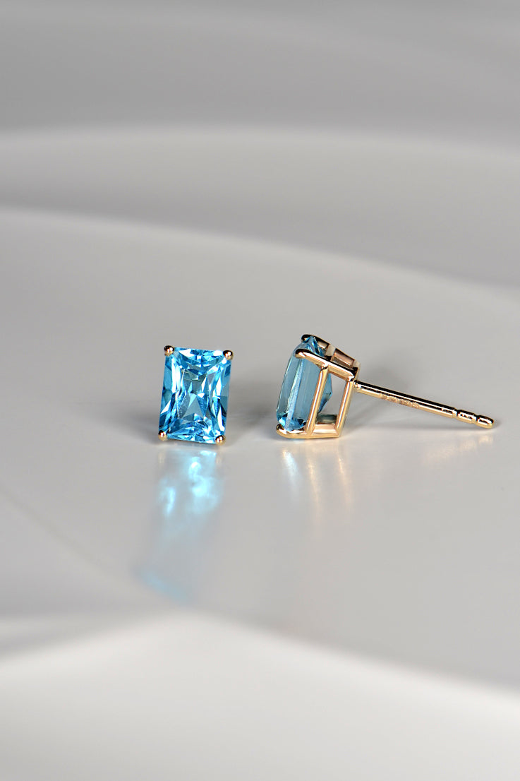 Radiant cut blue topaz gold earrings