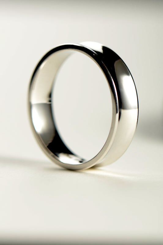 Unusual concave designer wedding ring for a man