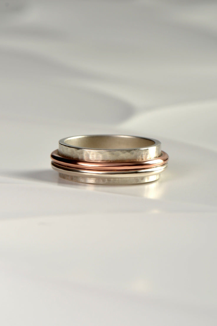 Handmade hammered silver and rose gold ring