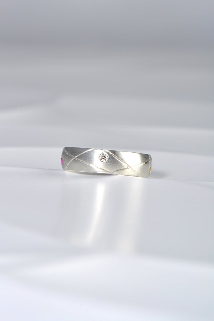 modern brushed silver ring set with a diamond from Christine Sadler's Afternoon Tea collection of jewellery