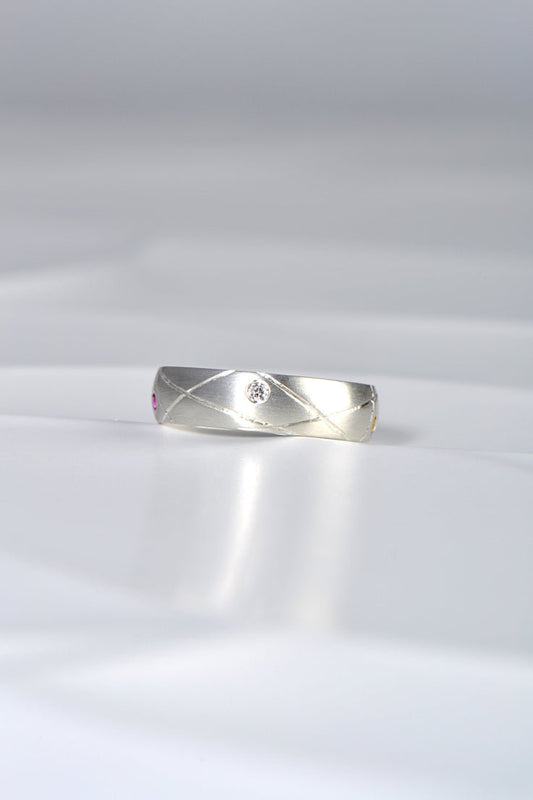 modern brushed silver ring set with a diamond from Christine Sadler's Afternoon Tea collection of jewellery