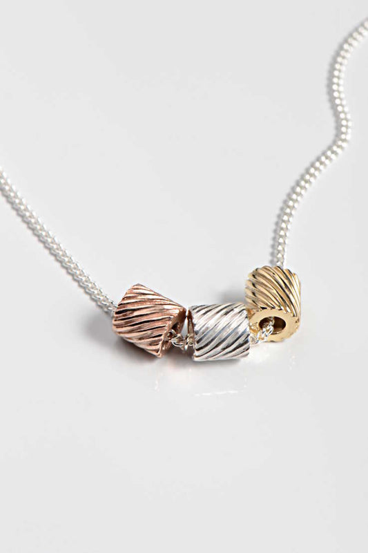Fun necklace in silver, yellow gold and rose gold from Christine Sadler's Bella Figura collection which is inspired by pasta