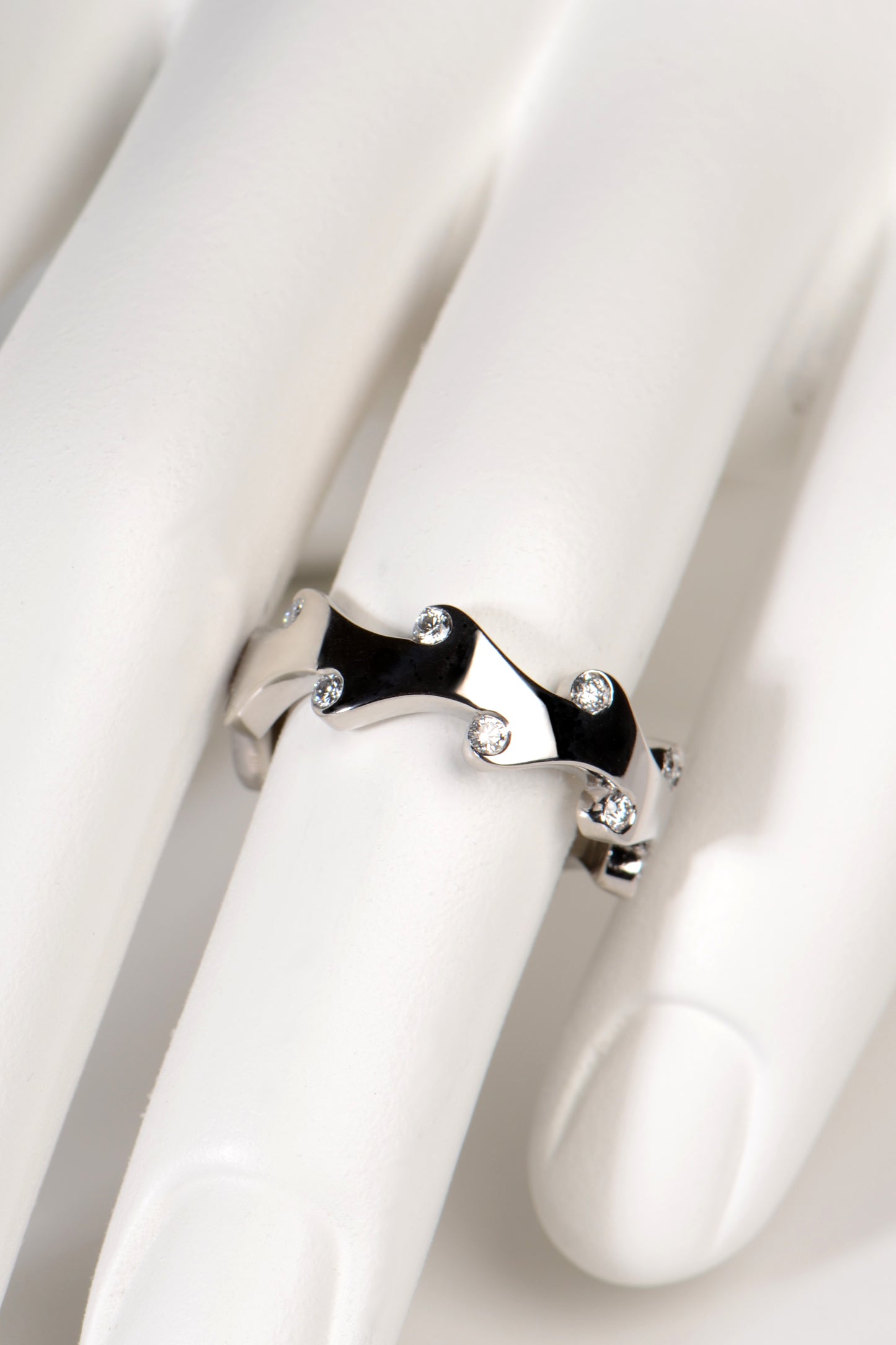 Modern sculptural platinum and diamond ring inspired by fire from British jewellery designer Christine Sadler. This ring can be a wedding or eternity ring or a right hand ring.