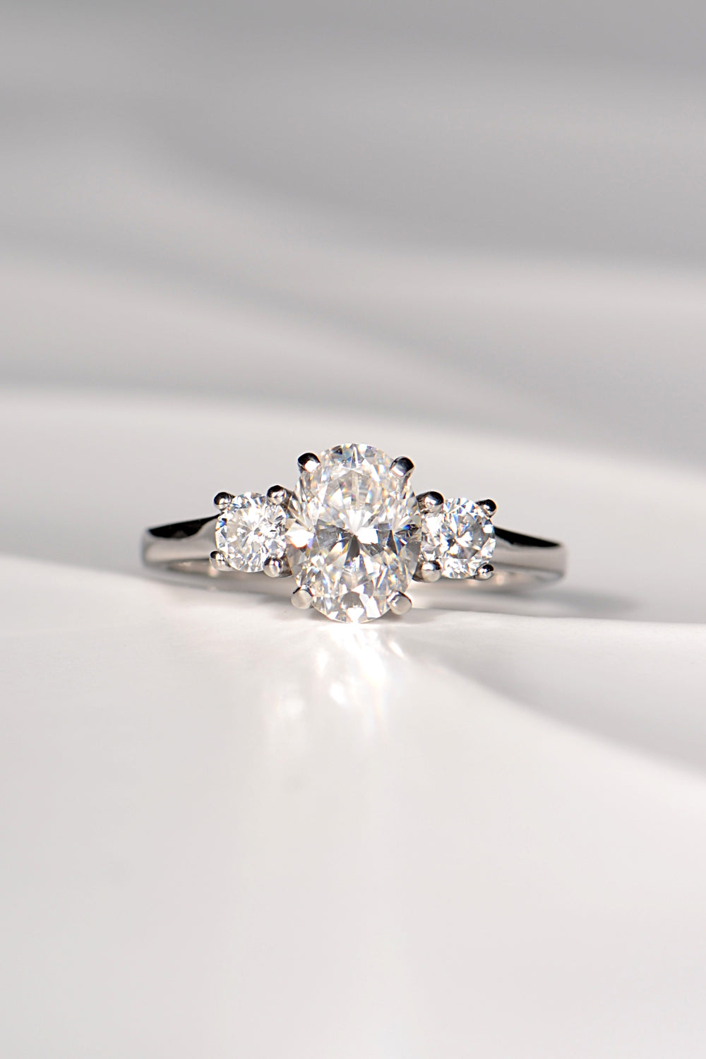 Moissanite platinum trilogy engagement ring