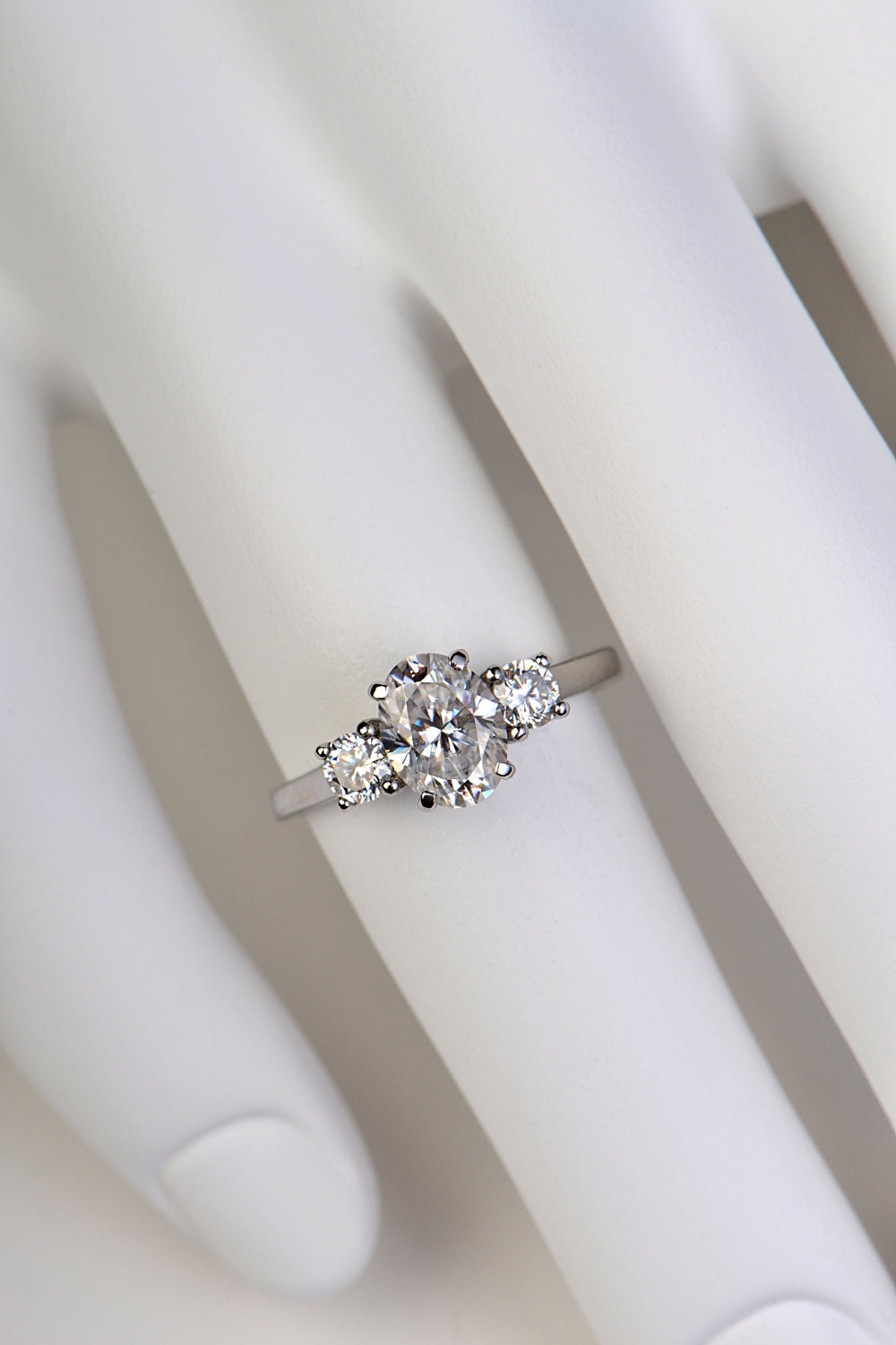 Moissanite platinum trilogy engagement ring