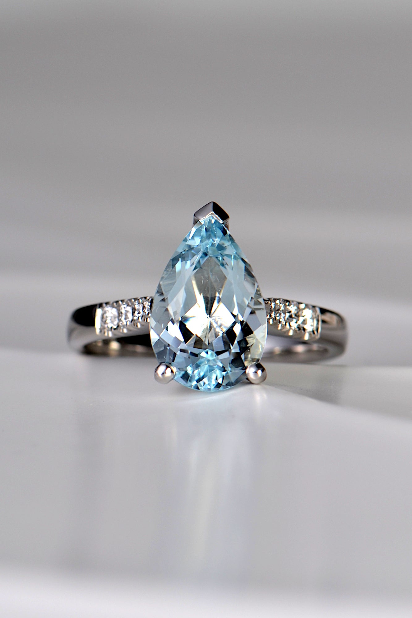 Aquamarine pear cut diamond platinum ring