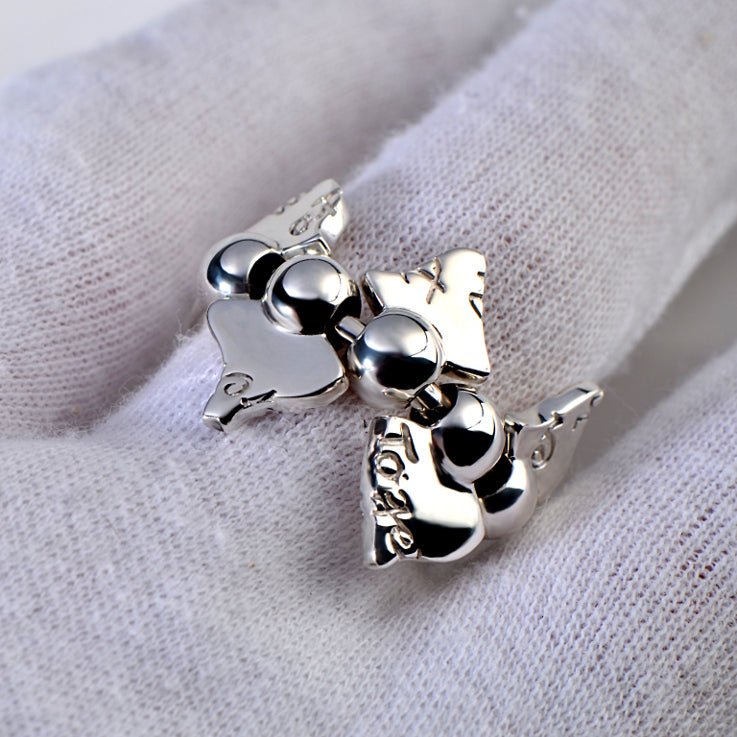 silver designer ring with moving parts and secret engraving