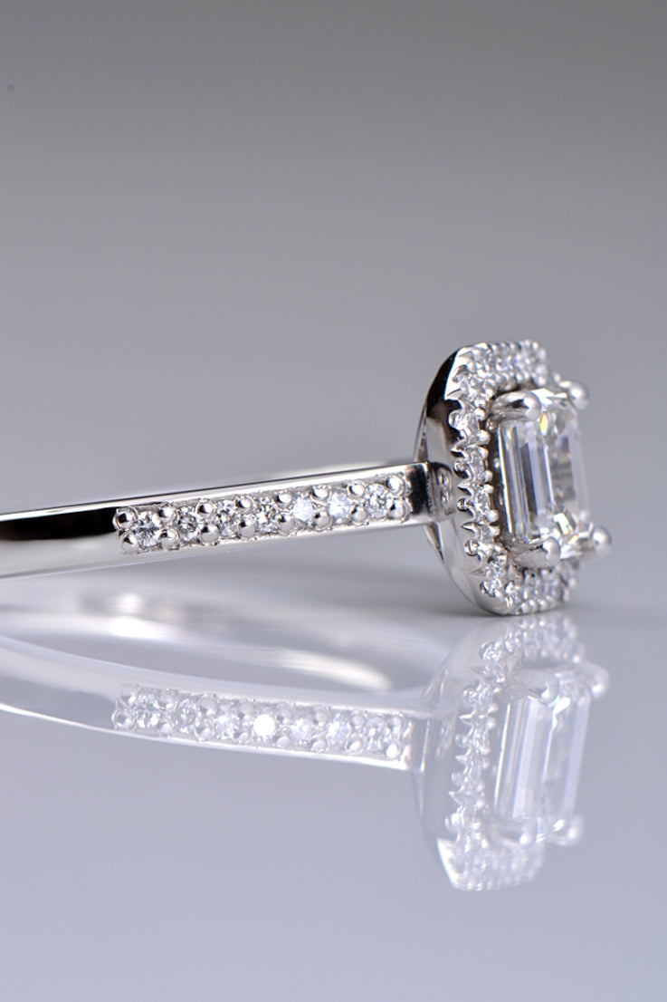 Platinum emerald cut diamond halo ring