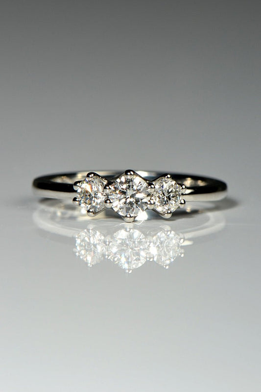handmade exclusive three stone platinum ring with cathedral setting from scottish jewellery designer Christine Sadler