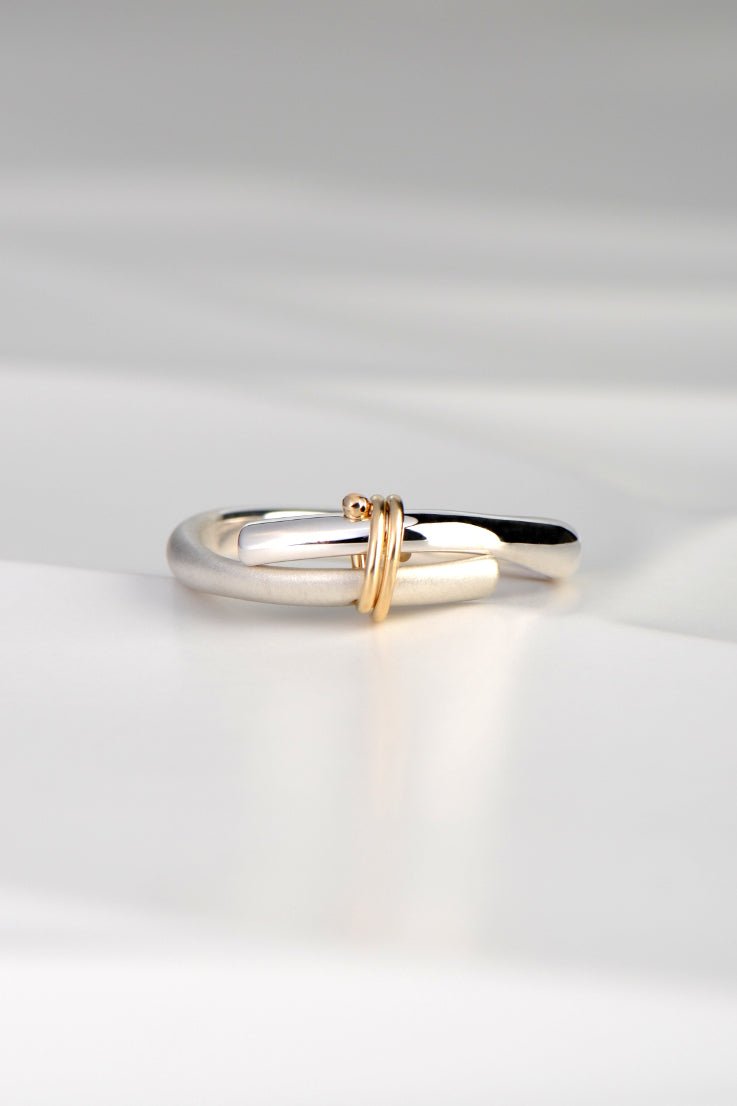 elegant silver ring with 9ct gold bond, a romantic design available exclusively from Christine Sadler