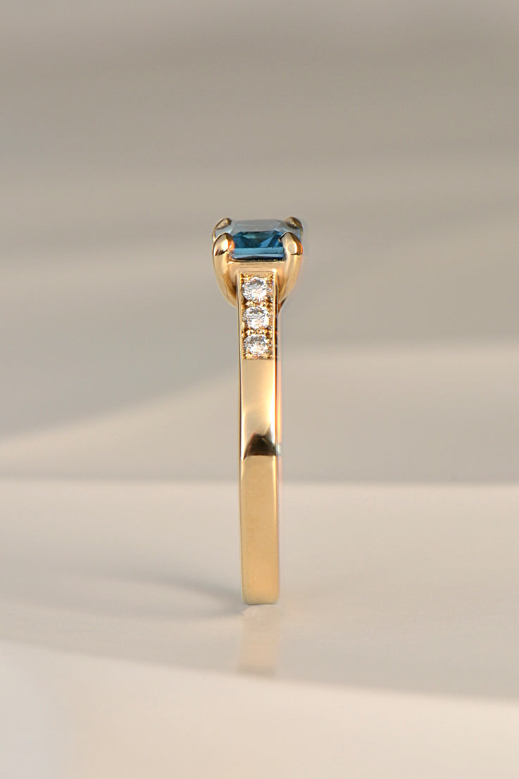 Blue topaz and diamond radiant ring.