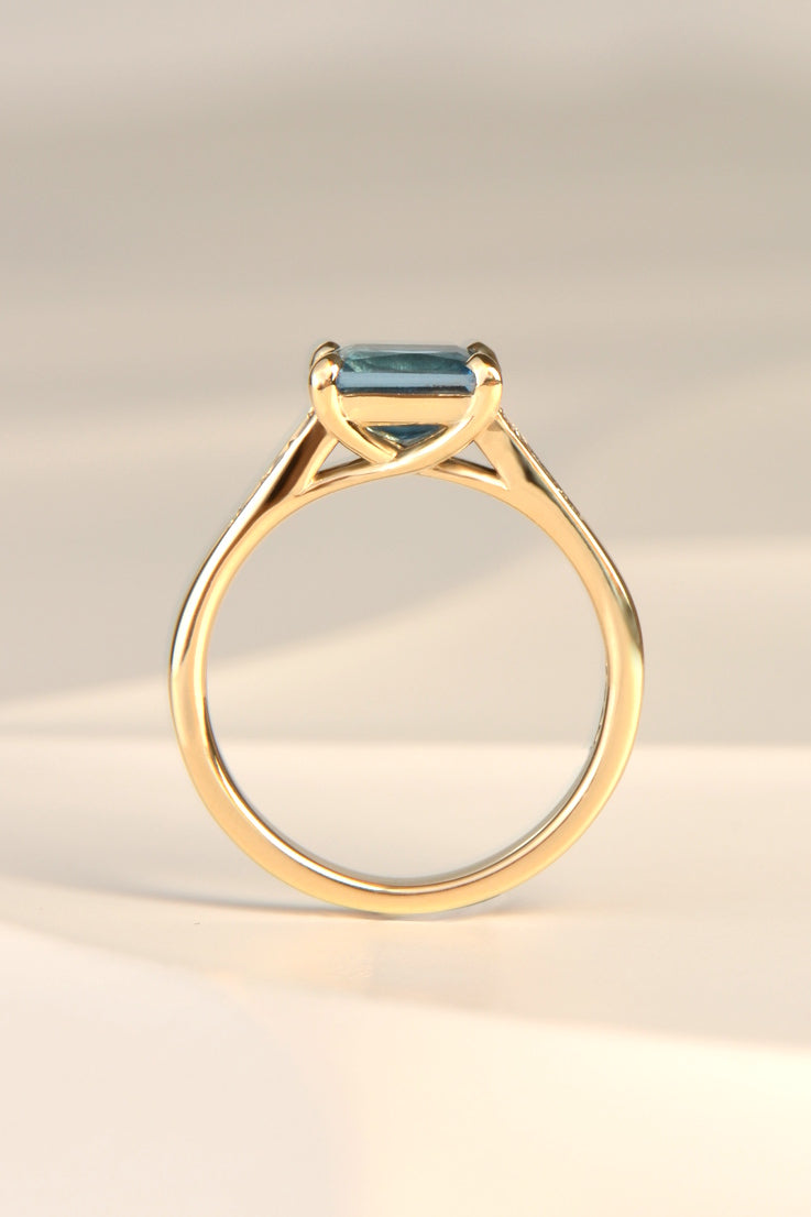 Blue topaz and diamond radiant ring.