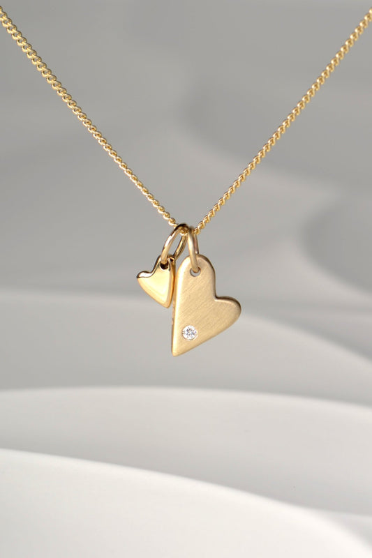 9ct yellow gold double heart necklace with diamond, brushed and polished finishes on 45cm curb chain — From The Heart collection by Christine Sadler