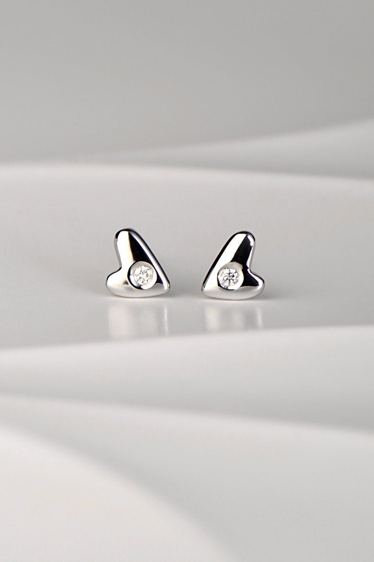 9ct white gold diamond heart stud earrings with high polish finish displayed on a white background from the From The Heart collection by Christine Sadler