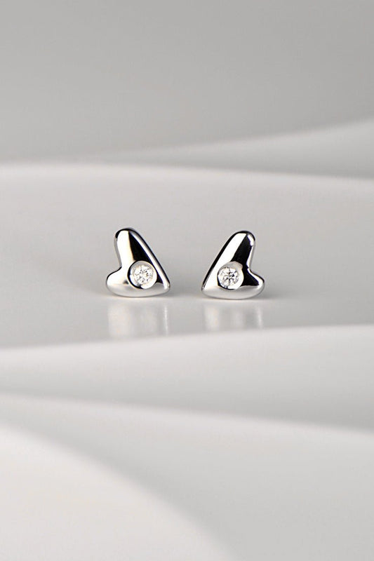 9ct white gold diamond heart stud earrings with high polish finish displayed on a white background from the From The Heart collection by Christine Sadler