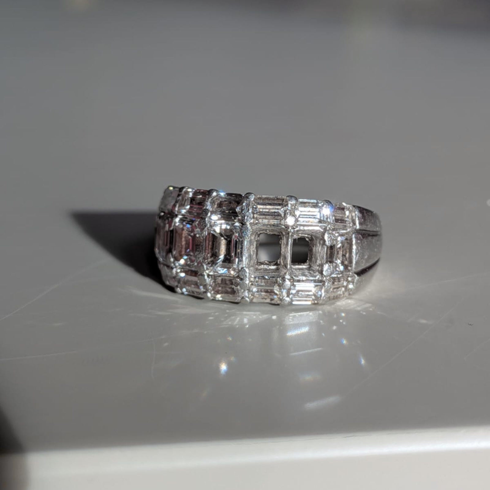 diamond ring with two diamonds missing