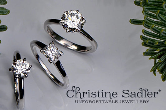 Three diamond rings with pine branches - annual claw check reminder to sparkle at Christmas
