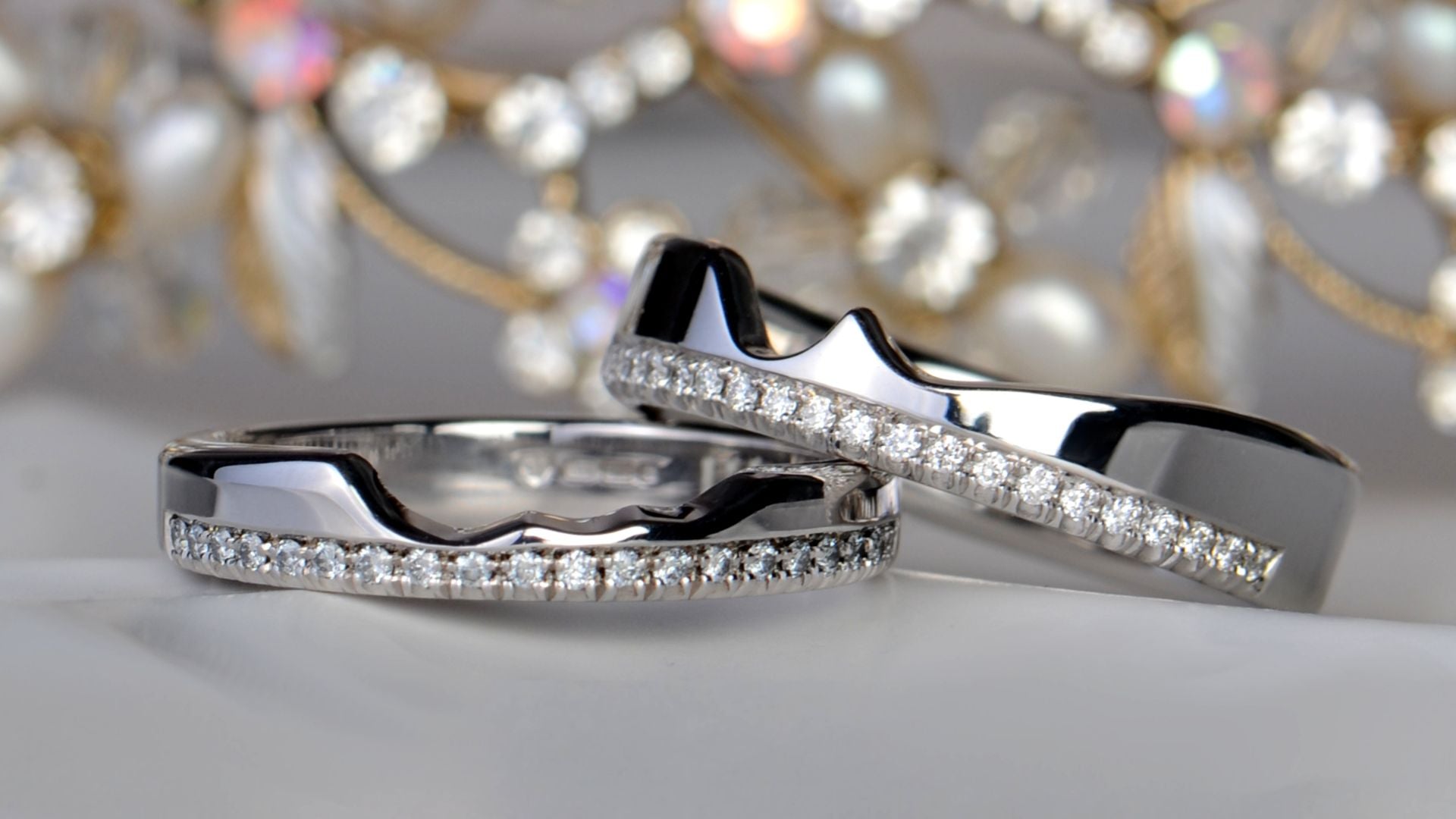 Bespoke shaped wedding ring custom fitted around an engagement ring, designed in Ayr Scotland