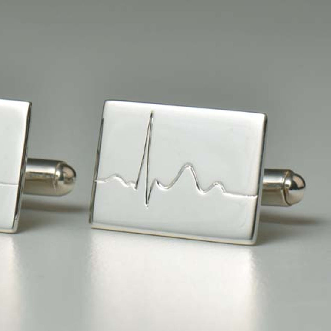 Silver cufflinks handmade for a heart surgeon.
