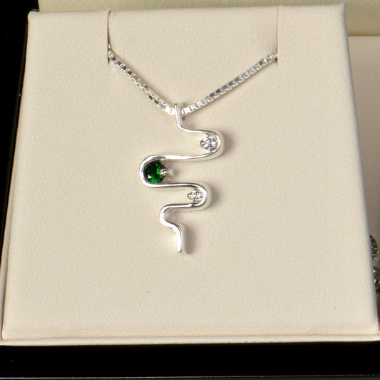 Kathryn’s heartbeat necklace in platinum with green garnets and diamonds, celebrating her strength and 18th birthday - Christine Sadler
