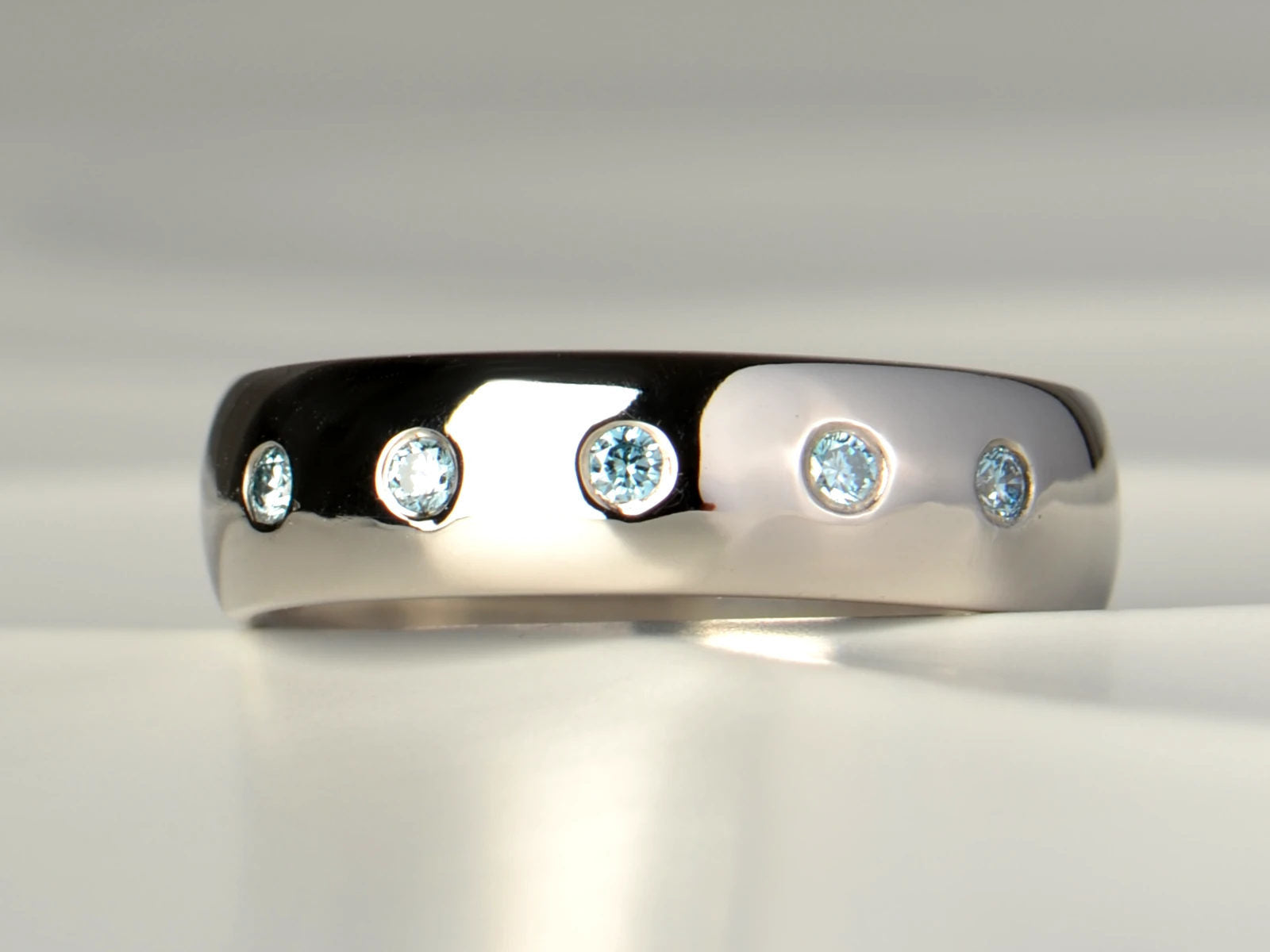 Palladium wedding ring with five round blue diamonds - christine sadler