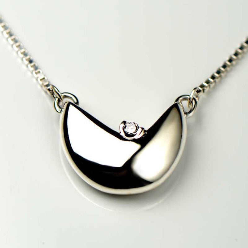 A handmade pendant made for a customer using their diamond.