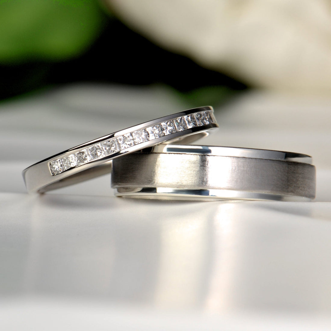 His and hers weddings rings in platinum with princess cut diamonds for her and platinum with silver for him