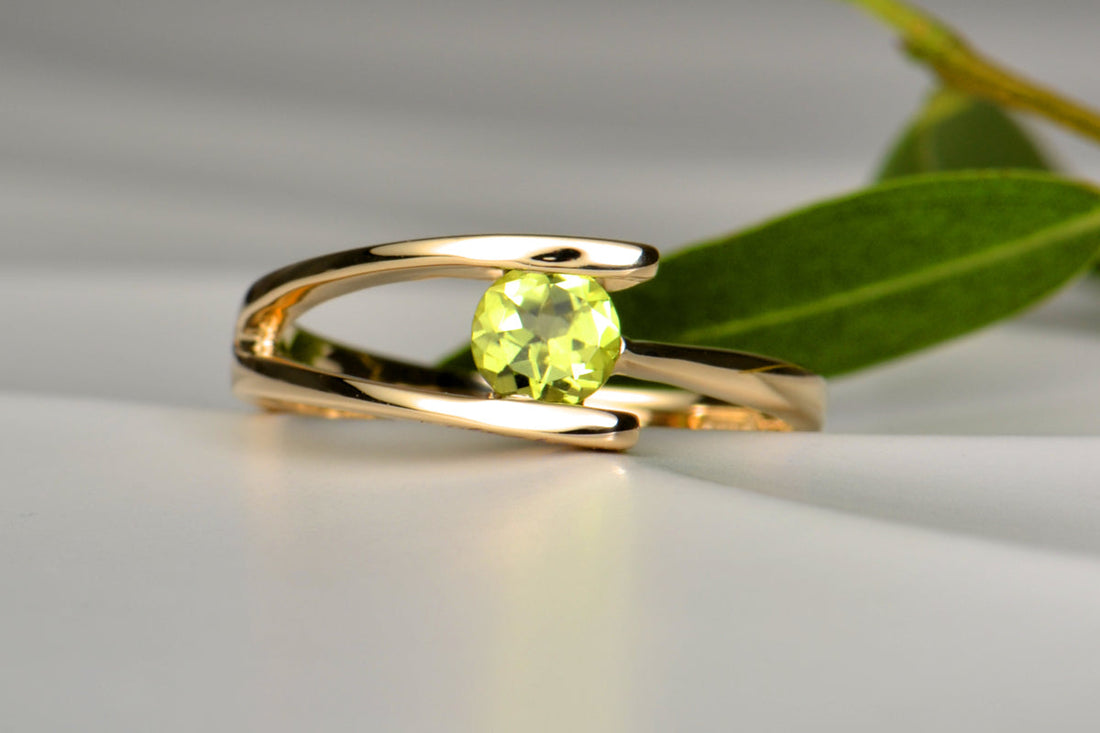 Bespoke peridot olive branch ring commission by Christine Sadler