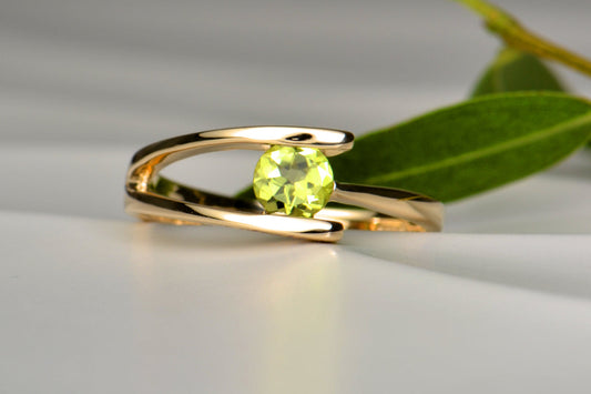 Bespoke peridot olive branch ring commission by Christine Sadler